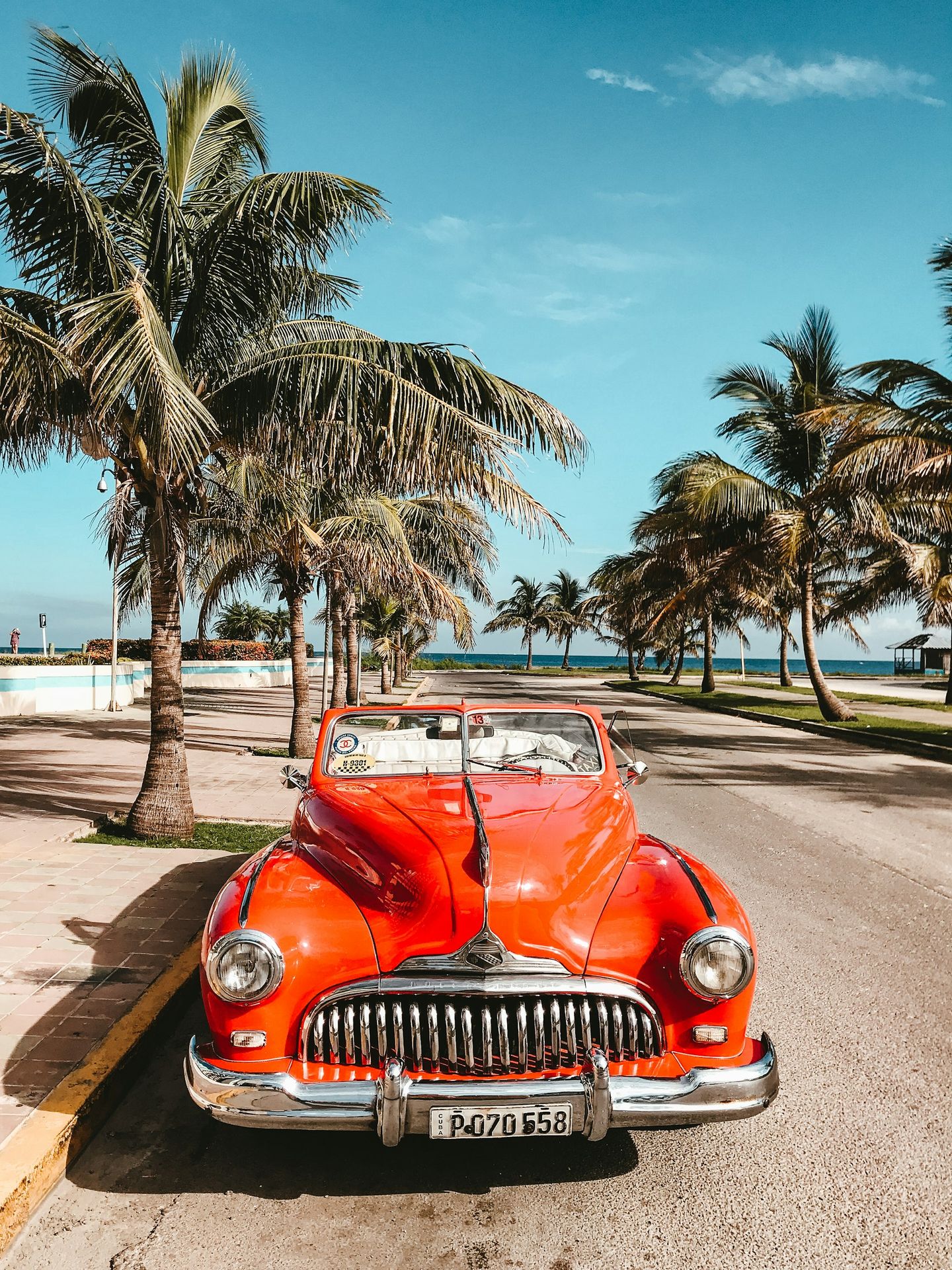 orange car on asphalt road